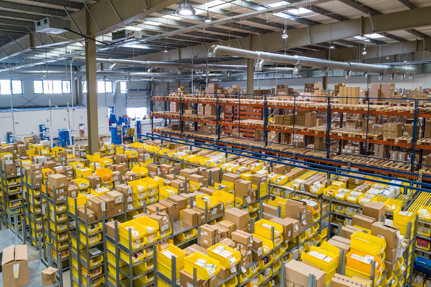 Warehouse shelving stocked with packaged consumer goods and cartons